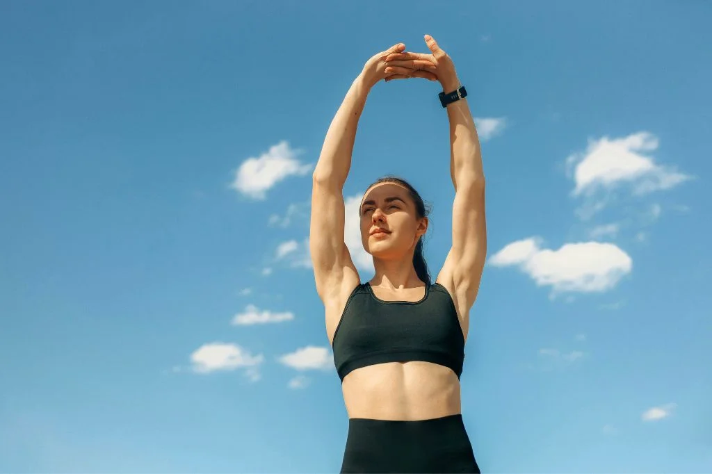 A fully recovered individual enjoying full shoulder mobility and pain-free movement in Bali.