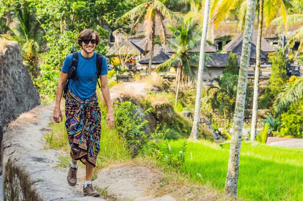 A traveler enjoying full, pain-free physical mobility in Bali after successful musculoskeletal recovery.