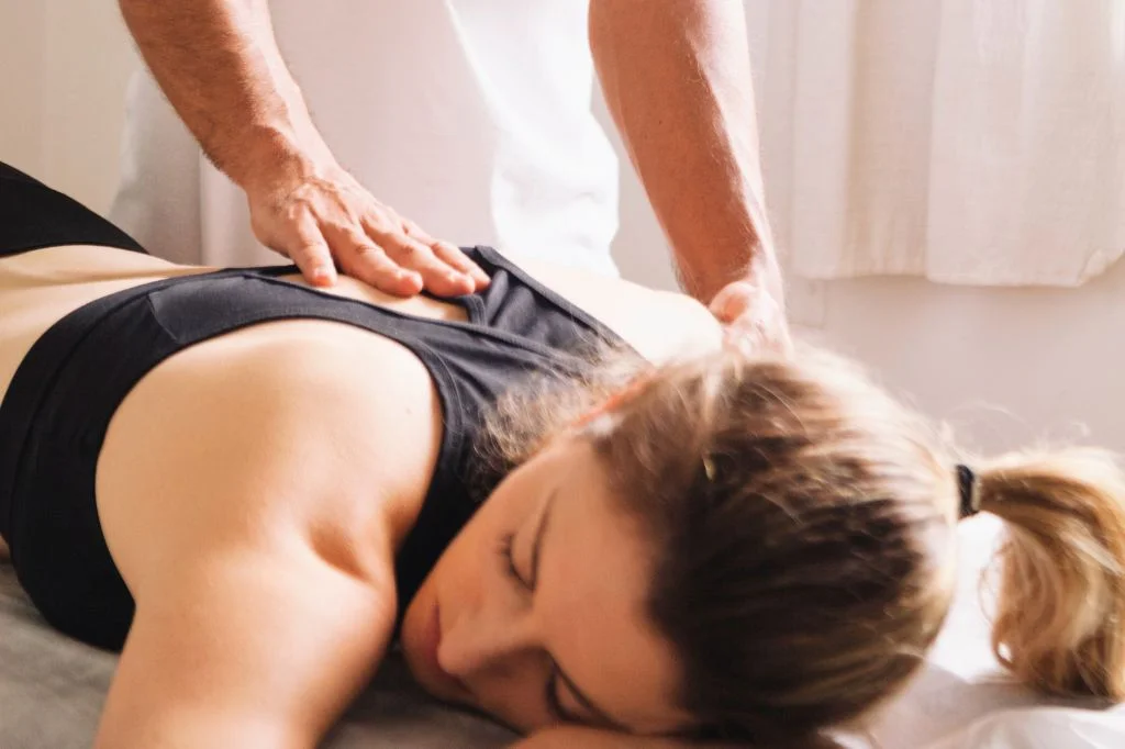 A professional home visit physiotherapy session for spinal decompression at a private Bali villa.