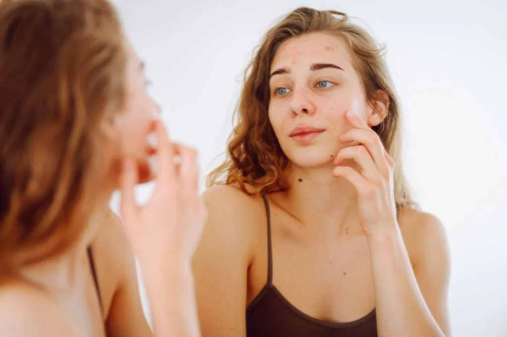 Tourist checking their skin in a mirror while on holiday in Bali