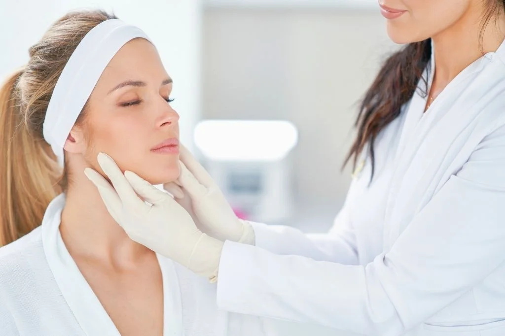 Dermatologist checking patient's face in a botox consultation