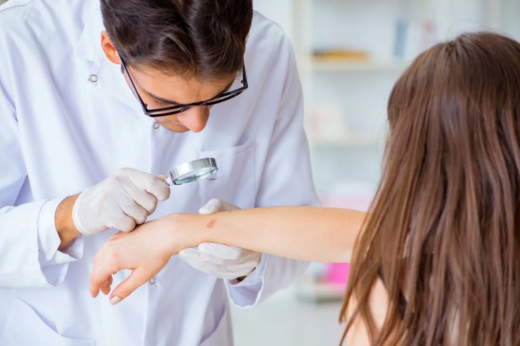 Dermatologist gently examining a child patient with a parent present in a Bali clinic