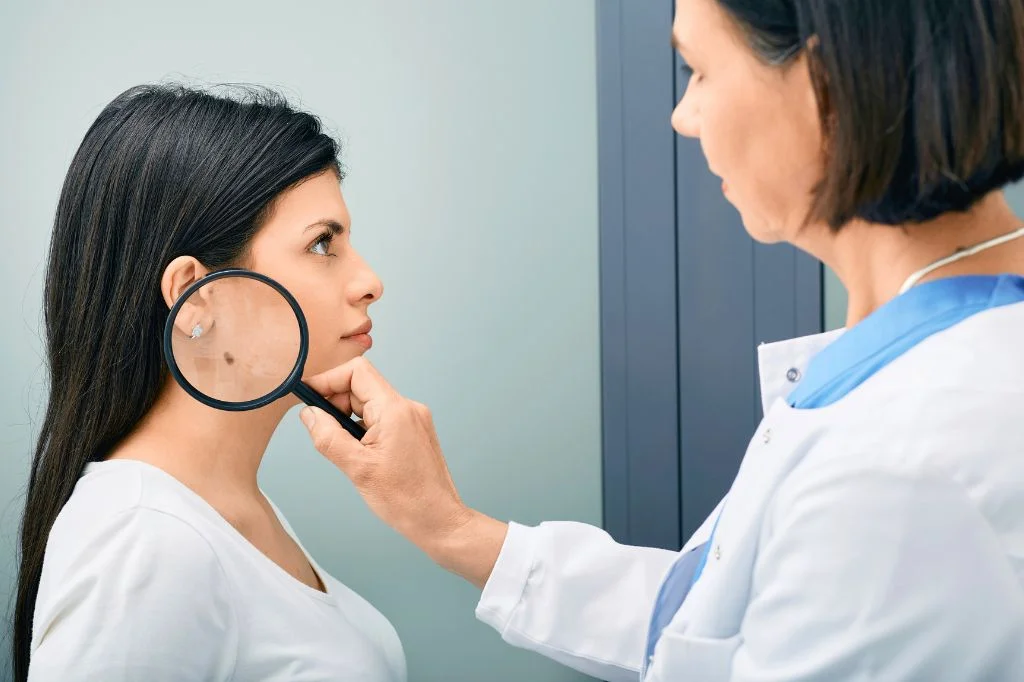 Dermatologist reviewing a patient's skin at a bright Bali clinic