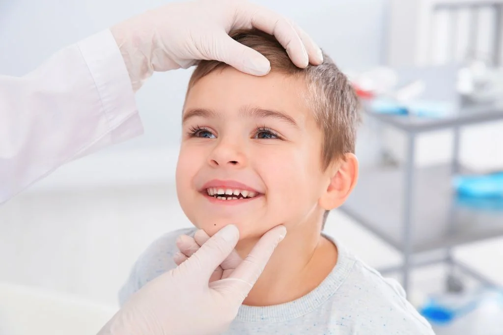 Dermatologist and a kid patient in conversation during a consultation