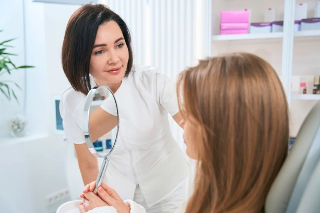 Dermatologist examining a patient's skin in the clinic