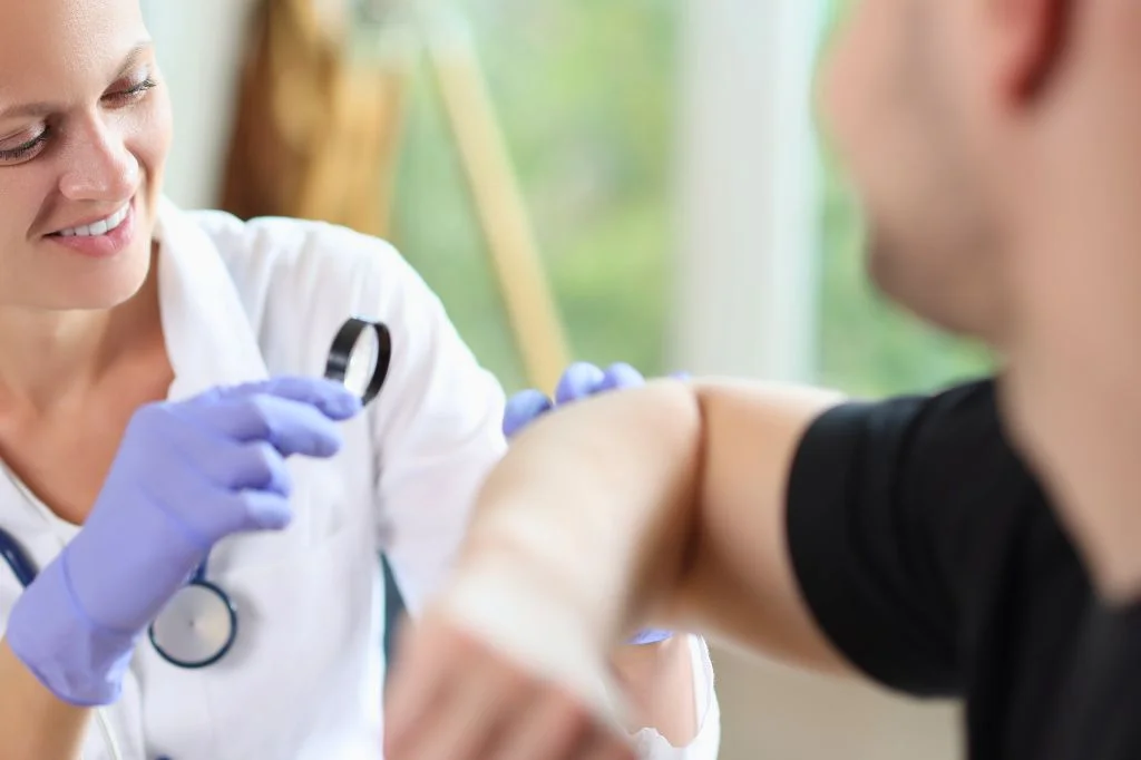 Dermatologist examining a patient's arm at a Bali clinic