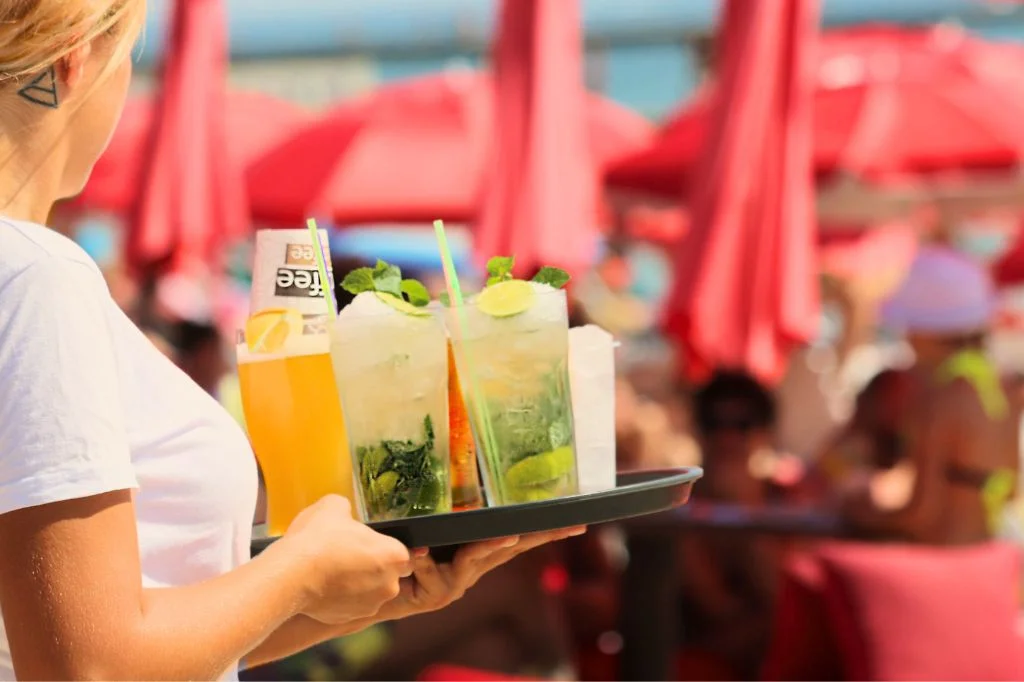 Fresh limes and a cocktail at a Bali beach club, a common source of lime burn on skin