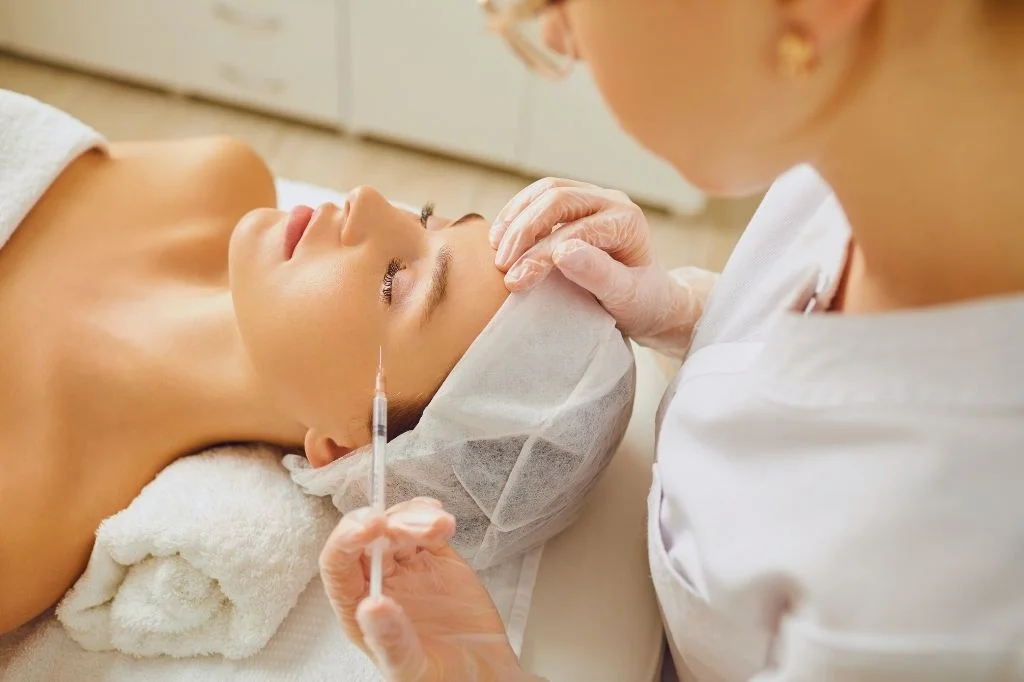 Relaxed patient at a bright, modern clinic in Bali before a Botox appointment