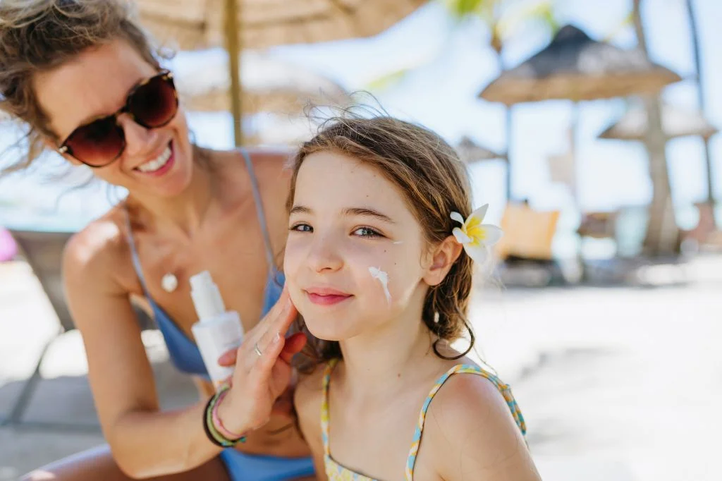 Traveler applying sunscreen outdoors in Bali