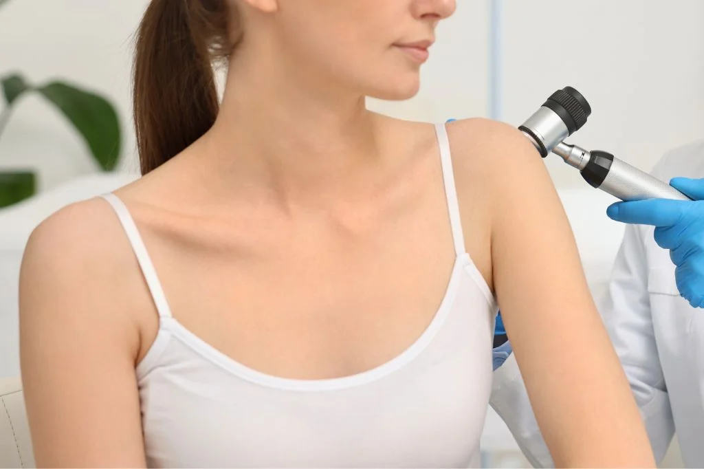 Dermatologist examining a patient's shoulder and back at a Bali clinic