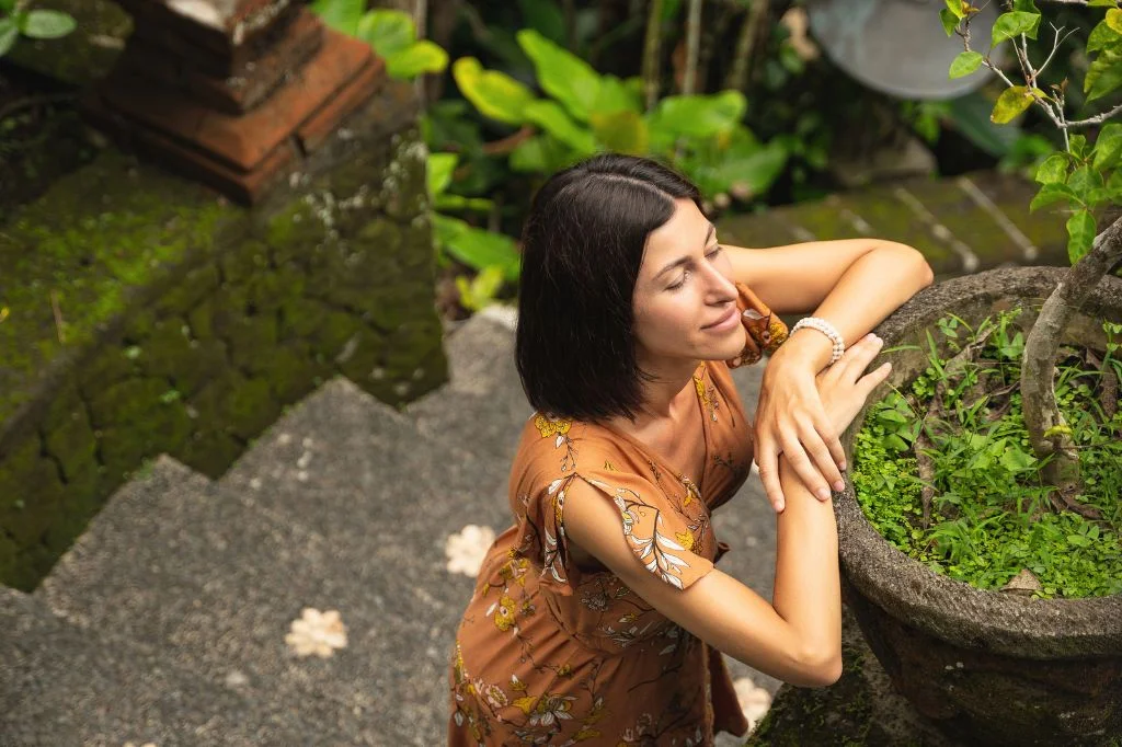 Relaxed traveler with clear, healthy-looking skin enjoying vacation in Bali after a consultation